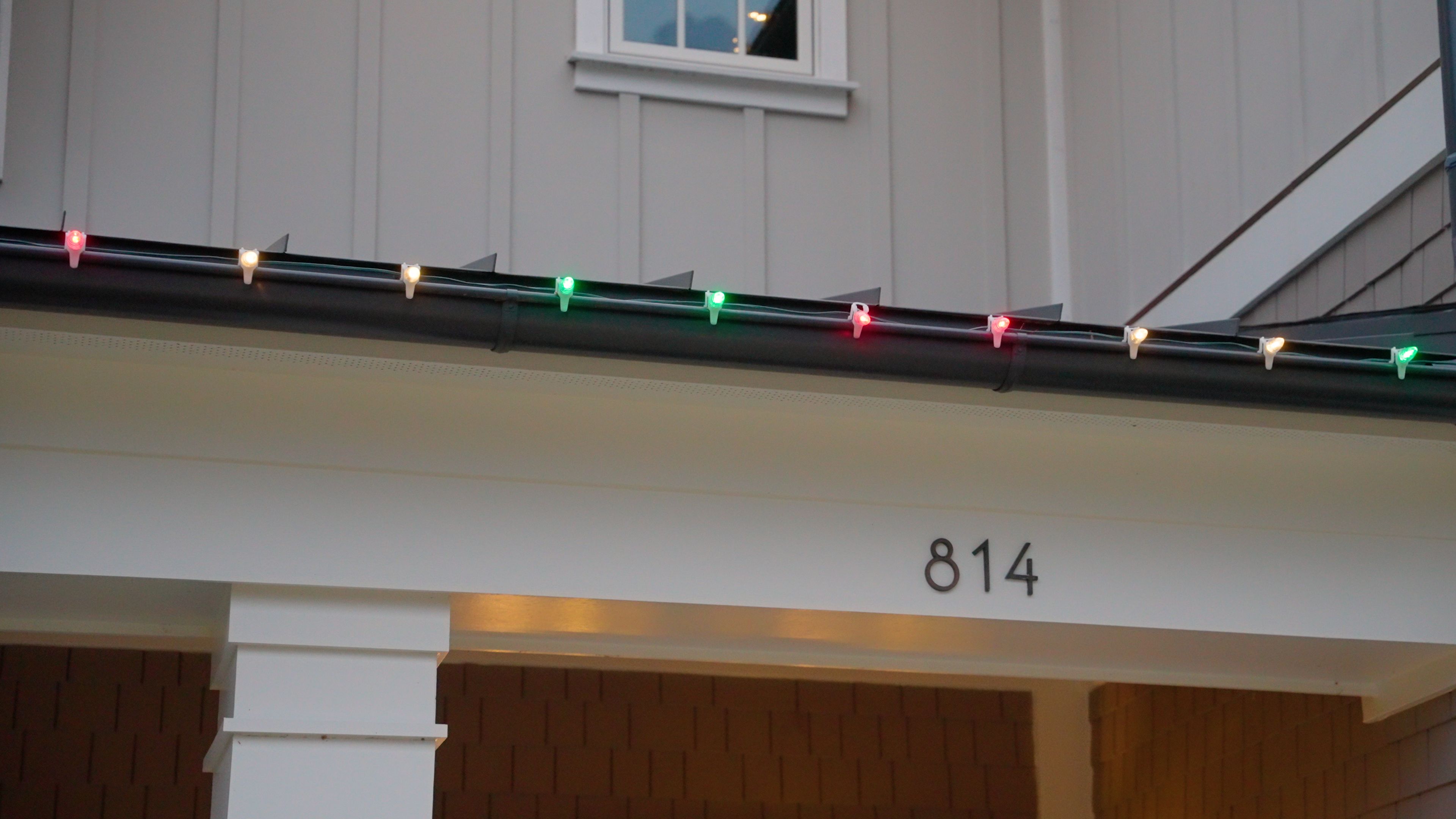 An image showing a Window Ninjas technician cleaning a dryer vent.
